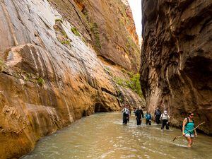 (Trent Nelson  |  The Salt Lake Tribune) Hikers are photographed in The Narrows, in Zion National Park, Wednesday May 6, 2015. The popular hike is prone to flash floods like the one that caught up several hikers Friday, Aug. 19, 2022. One hiker was still missing Sunday after that flood.
