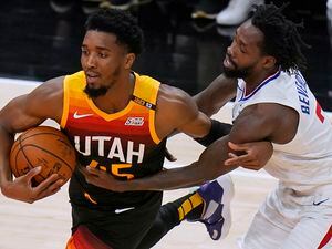 Los Angeles Clippers guard Patrick Beverley, right, fouls Utah Jazz guard Donovan Mitchell during the first half of Game 5 of a second-round NBA basketball playoff series Wednesday, June 16, 2021, in Salt Lake City. (AP Photo/Rick Bowmer)