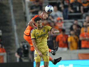 Houston Dynamo's Daniel Steres, rear, heads the ball over Real Salt Lake's Bertin Jacquesson (27) during the first half of an MLS soccer match Saturday, May 6, 2023, in Houston. (AP Photo/David J. Phillip)