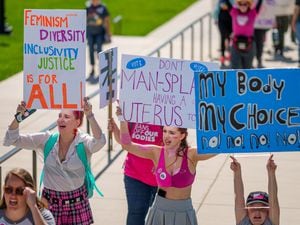 (Trent Nelson  |  The Salt Lake Tribune) People march around the State Capitol in Salt Lake City in support of abortion rights on Saturday, Oct. 8, 2022.