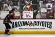 Arizona Coyotes' Dylan Guenther skates past fans as players warm up for an NHL hockey game against the Edmonton Oilers on Wednesday, April 17, 2024, in Tempe, Ariz. The Coyotes are moving to Salt Lake City. (AP Photo/Ross D. Franklin)