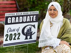 (Rick Egan | The Salt Lake Tribune)  Fatima Al-Saedy wears a keffiyeh (a traditional Arabic scarf) that she would like to wear at her Copper Hills graduation with her cap and gown to honor her family.
