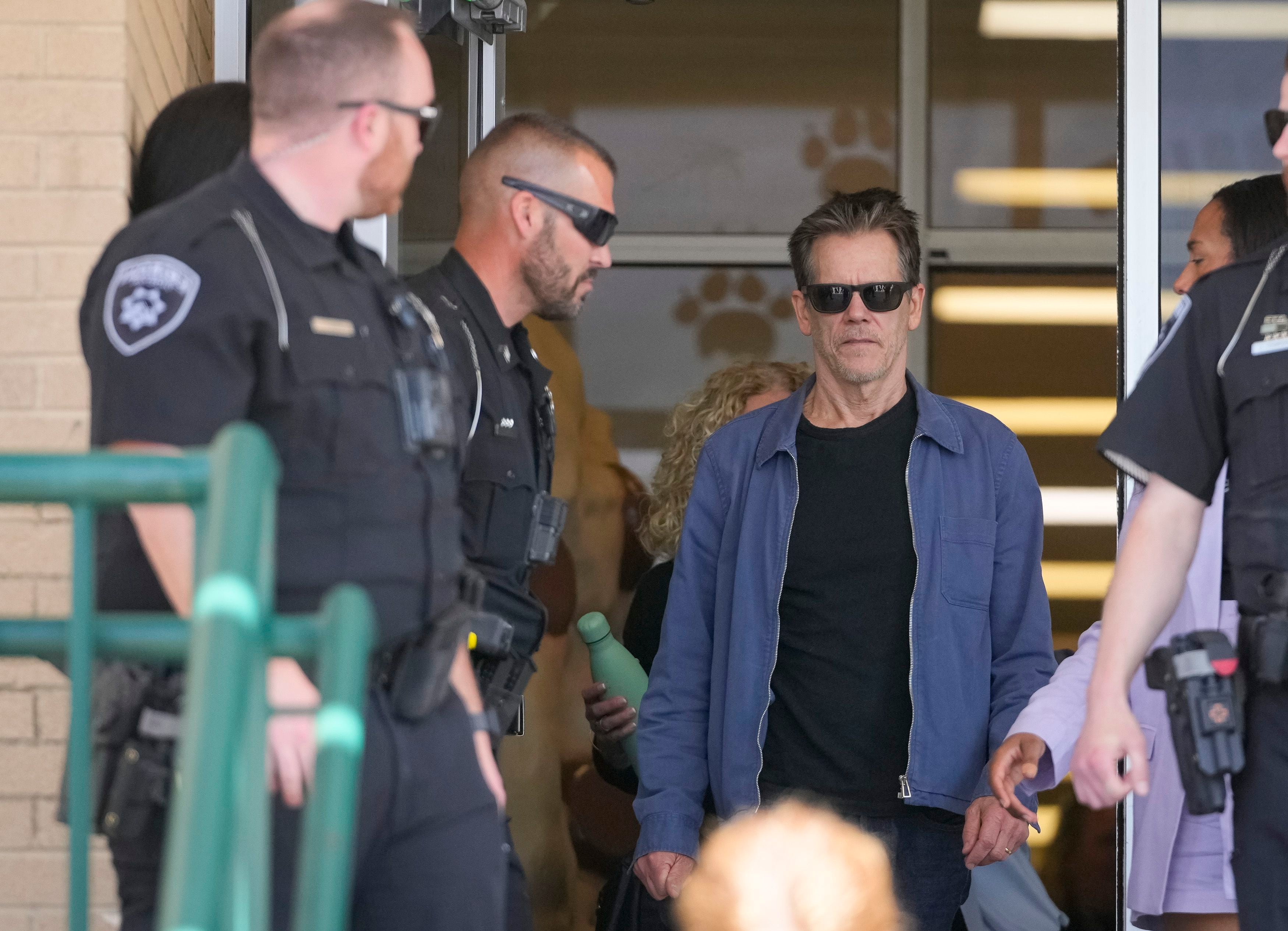 (Bethany Baker  |  The Salt Lake Tribune) Kevin Bacon walks out of Payson High School after a charity event to commemorate the 40th anniversary of the movie "Footloose" in Payson on Saturday, April 20, 2024.