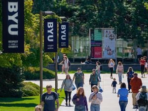 (Francisco Kjolseth | The Salt Lake Tribune) Students and patrons walk between classes on the BYU campus in Provo in September 2022. Tribune columnist Gordon Monson argues that the school's professors should be freed up to pursue truth wherever it leads them.