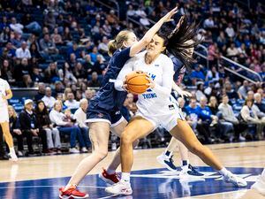 (BYU Athletics) BYU women's basketball center Lauren Gustin muscles through a defender during a game against St. Mary's on Dec. 31, 2022 at the Marriott Center in Provo.