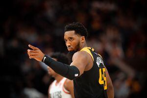 (Rachel Rydalch | The Salt Lake Tribune) Utah Jazz guard Donovan Mitchell (45) points in celebration in NBA action against the Portland Trail Blazers in the Vivint Arena on Wednesday, March 9, 2022.