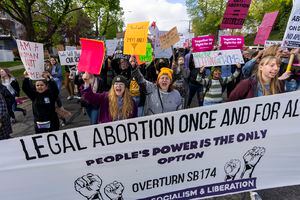 (Rick Egan | The Salt Lake Tribune) Hundreds of protesters march in downtown Salt Lake City in a protest hosted by Planned Parenthood, on Tuesday, May 3, 2022, a day after a leaked draft opinion indicated the U.S. Supreme Court may overturn Roe v. Wade, a 1973 landmark abortion decision.