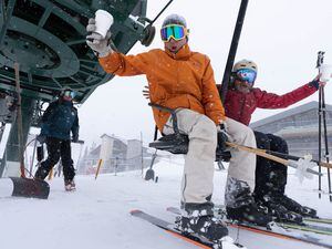 (Francisco Kjolseth | The Salt Lake Tribune) Skiers revel in a little bit of Alta history as they ride the Albion two-person ski lift on its final day of operation on Tuesday, April 12, 2022. Installed in 1962, the lift will be torn down in addition to the Sunnyside lift that services the same area to make room for a new six-person high-speed lift next season.
