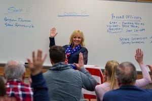 (Trent Nelson  |  The Salt Lake Tribune) Registered Republicans in a South Jordan precinct vote for state delegates on GOP caucus night in a Bingham High School classroom on Tuesday, March 8, 2022. At center is precinct chair Janalee Tobias.