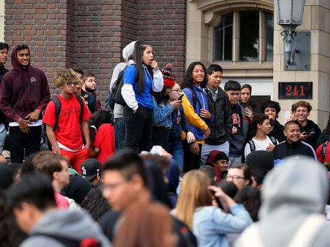 Students walk out of West High School after their principal is put on leave