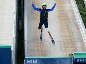 (Francisco Kjolseth | The Salt Lake Tribune) NASCAR driver Bubba Wallace tries ski jumping for the first time at the Utah Olympic Park on Wednesday, July 13, 2022. The US Ski & Snowboard team hosted several professional drivers for a bobsled run, an aerials demonstration and a workout at the training center.