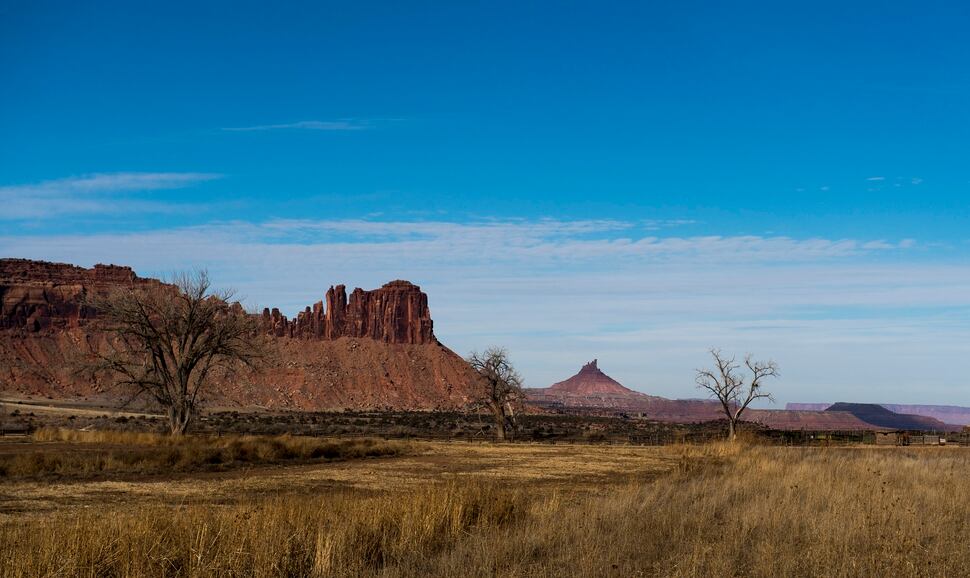 (Rick Egan | Tribune file photo) In 2016, the Bureau of Land Management approved a 6.4-mile motorized route in Indian Creek crossing the historic Dugout Ranch, pictured recently, inside the new Bears Ears National Monument. The trail is located north of Six Shooter Peak, seen in the distance. San Juan County has long sought a right of way here to bridge popular riding areas on either side of State Route 211, but conservationists and one local rancher feared a new trail would invite motorized use in places where it doesn't belong.