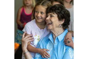 (Rick Egan | The Salt Lake Tribune) Louise Bitner get hugs from her student, Emma Croft, on her last day as a teacher at Dilworth Elementary School, on Friday, June 3, 2022. Bitner is retiring after 51 years as a kindergarten and first grade teacher.