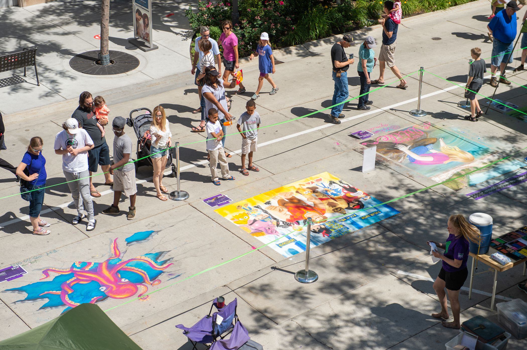 (Rachel Molenda | The Salt Lake Tribune) Spectators take in the work of artists at a chalk art festival in 2018 at The Gateway in Salt Lake City. Such events can help attract families.
