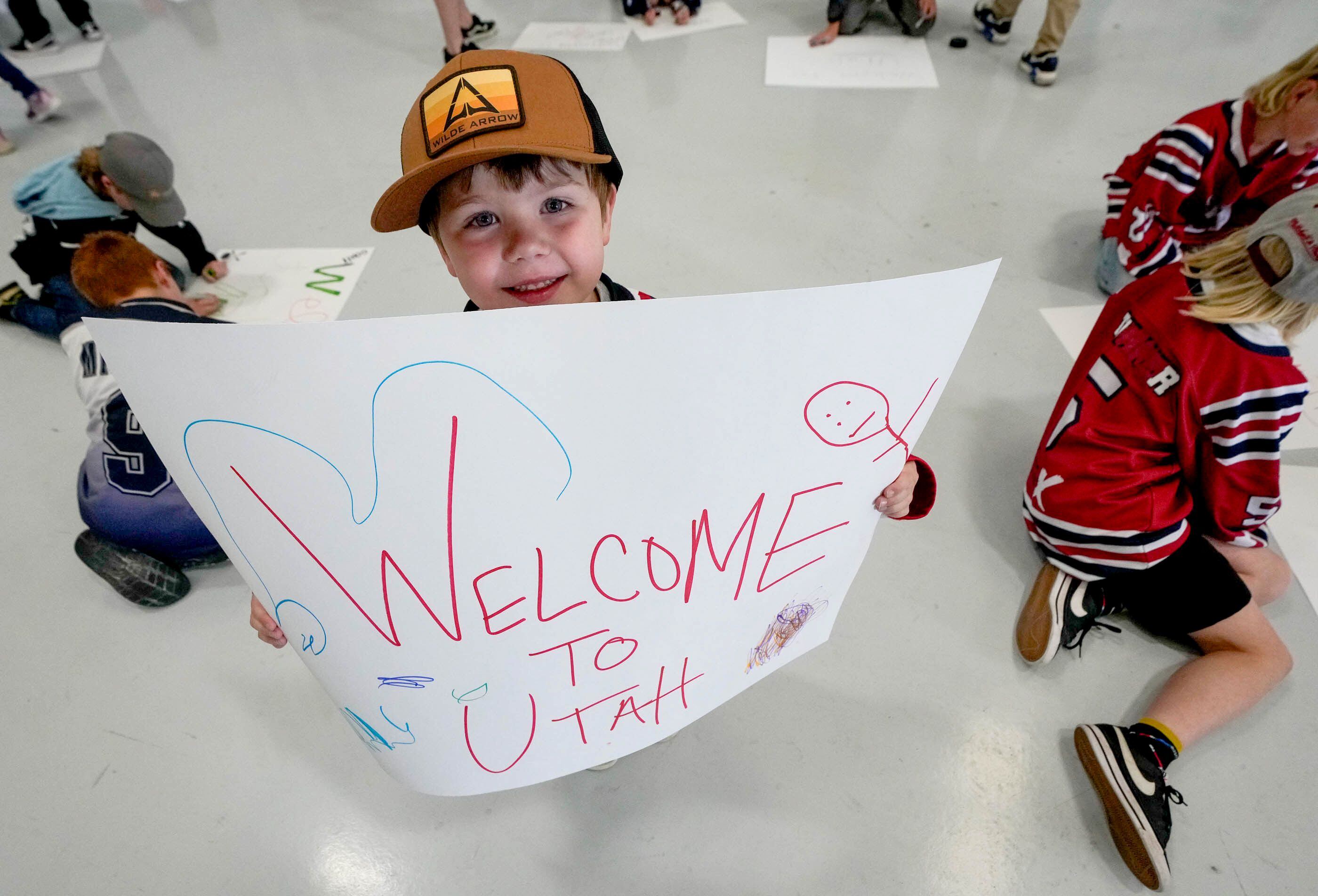 (Francisco Kjolseth  |  The Salt Lake Tribune) Mason Davis shows off his sign as he joins other hockey fans to welcome Utah’s new NHL hockey team to Salt Lake City on Wednesday, April 24, 2024.