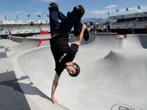 (Francisco Kjolseth  |  The Salt Lake Tribune)  Skate legend Tony Hawk delights the crowd with an invert as he joins other pro skaters for a community skate during a first look of the new Vans - Utah Sports Commission Skatepark at the Utah State Fairpark on Tuesday, Sept. 3, 2019. Hawk, who broke his leg in March, has promised to return to the ramp for the 'Legends Demo' portion of the Tony Hawk Vert Alert that will come to the Fairpark on Aug. 26-27, 2022.