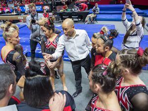 (Photo courtesy of Utah Athletics) Tom Farden coaches his Utah gymnasts during a meet at the Huntsman Center. Farden has been given a contract extension through 2026.