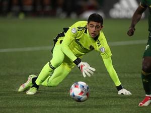 (Amanda Loman | AP) Real Salt Lake goalkeeper David Ochoa chases the ball during the first half of the team's MLS soccer Western Conference final against the Portland Timbers on Saturday, Dec. 4, 2021, in Portland, Ore.