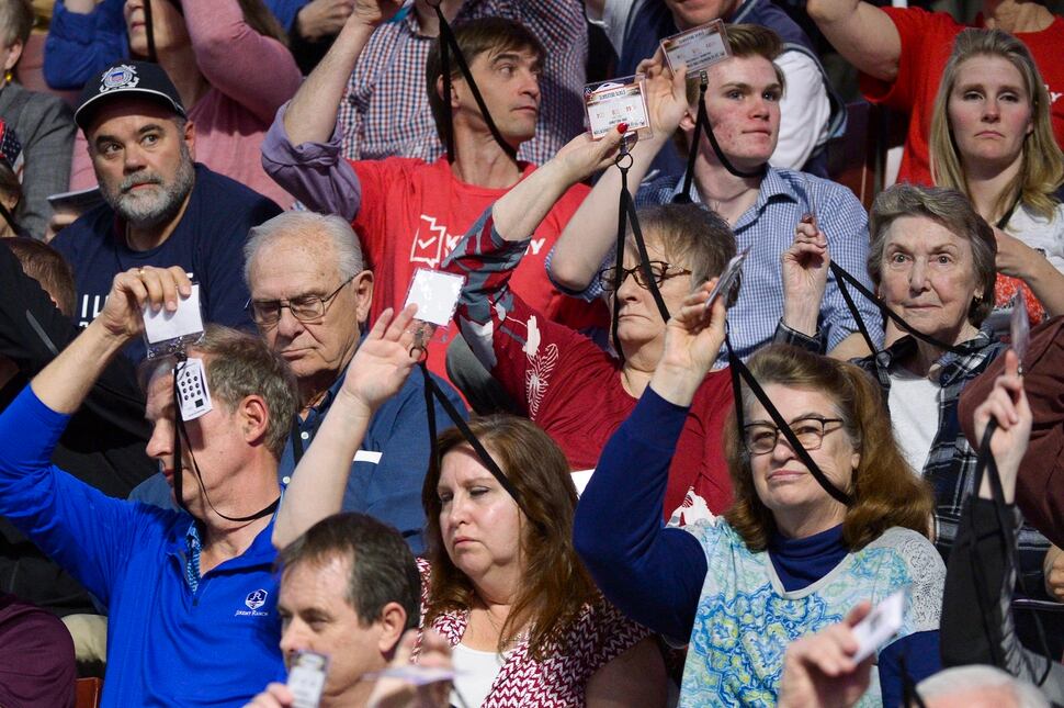 (Leah Hogsten | The Salt Lake Tribune) l-r Frustrations and weariness show on the faces of delegates as the convention drags on due to rigorous debate on bylaws, amendment proposals and rules at the Utah Republican Nominating Convention Saturday, April 21, 2018 at the Maverik Center. 