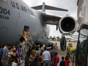 (Gordon Welters | The New York Times) A C-17 aircraft arrives with some of the final people evacuated from Afghanistan, at Ramstein Air Base in Germany, Monday, Aug. 30, 2021.