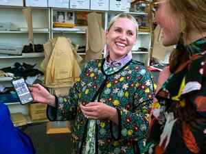 (Rick Egan  |  The Salt Lake Tribune)  Social media influencer Brittany Jepsen shares a photo with Hannah Lewis in the Utah Opera costume shop during a preview event for "Norma," at the Utah Opera Production Studios.