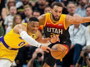 (Rick Egan | The Salt Lake Tribune) Utah Jazz center Rudy Gobert (27) goes for a loose ball along with Los Angeles Lakers guard Russell Westbrook (0), in NBA action between the Utah Jazz and the Los Angeles Lakers, at Vivint Arena, on Thursday, March 31, 2022.