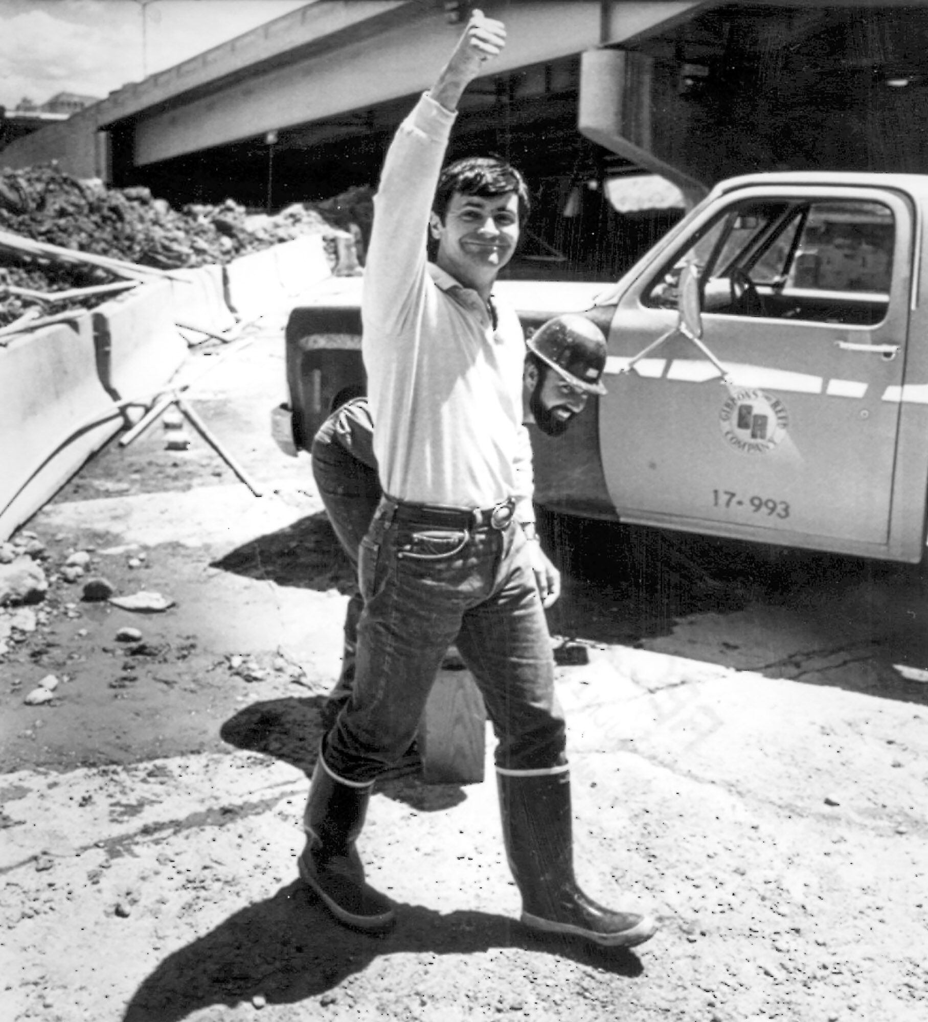 (AP) Ted Wilson gives a thumbs up after repairs were made to abate flooding along North Temple in 1983.