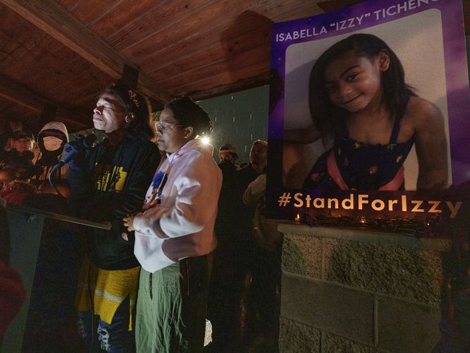 (Leah Hogsten | The Salt Lake Tribune) Brittany Tichenor-Cox, center, joined by her sister Jasmine Rhodes, right, speaks about her daughter Izzy Tichenor, Nov. 9, 2021. Hundreds joined the Tichenor family in mourning the death of 10-year-old Isabella "Izzy" Tichenor during a vigil at Foxboro Hollow Park in North Salt Lake on Tuesday.