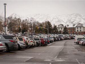 (Kristine Weller | KUER) A University of Utah U permit parking lot off of Mario Capecchi Drive. The lot serves both the U's medical center and the Eccles Broadcast Center and is frequently full, Jan. 27, 2023.