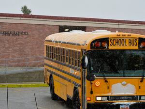 (Chris Samuels | The Salt Lake Tribune) Busses depart Millcreek Elementary School on Wednesday, Nov. 2, 2022. Millcreek and two other elementary schools were recommended to close under a proposal by the Granite School District.