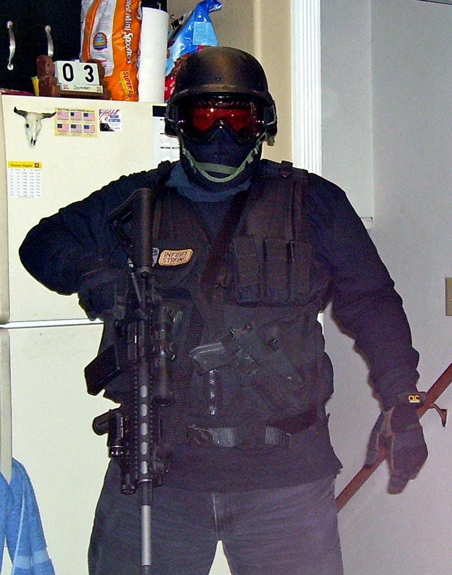 (via criminal complaint) This photo of a man in tactical gear was posted to Craig Deleeuw Robertson's Facebook page, according to a criminal complaint. Posts on the page made threats to assassinate President Joe Biden ahead of his visit to Utah. FBI agents shot and killed Robertson on Wednesday.