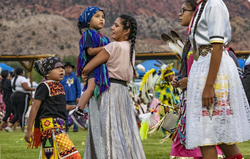 (Leah Hogsten | The Salt Lake Tribune Men, women and children from Native American tribes throughout the West show their regalia during the Grand Entry at the 41st Annual Paiute Indian Tribe of Utah Restoration Gathering, Aug. 13, 2021 in Cedar City, Utah. 