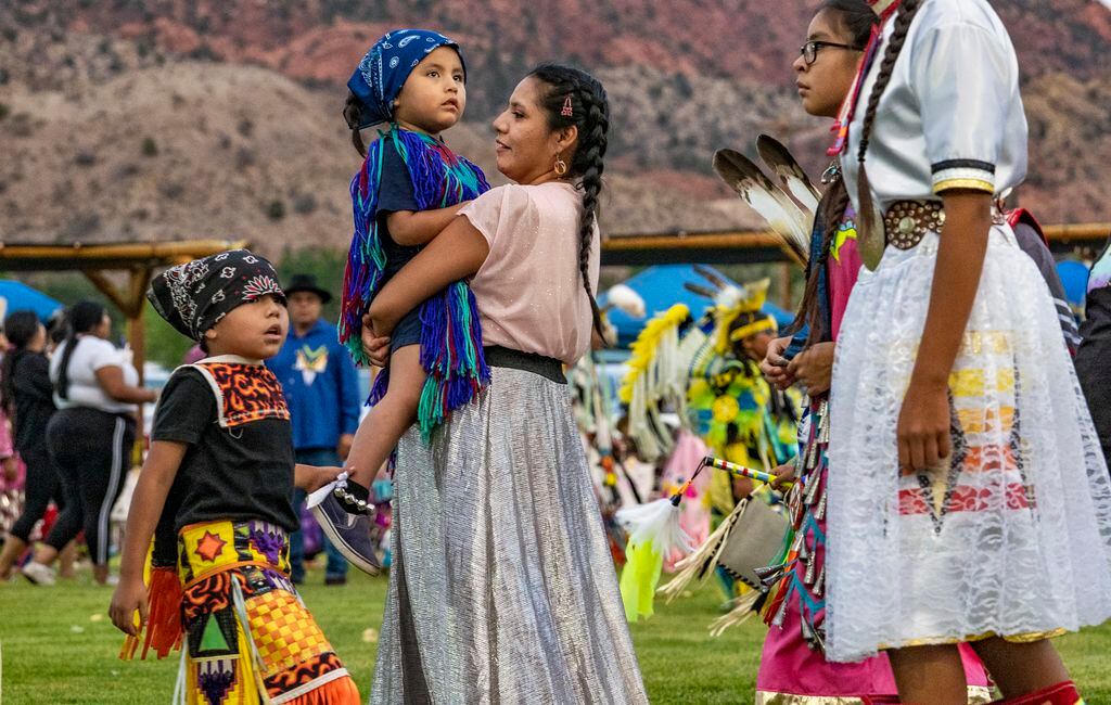 (Leah Hogsten | The Salt Lake Tribune Men, women and children from Native American tribes throughout the West show their regalia during the Grand Entry at the 41st Annual Paiute Indian Tribe of Utah Restoration Gathering, Aug. 13, 2021 in Cedar City, Utah. 