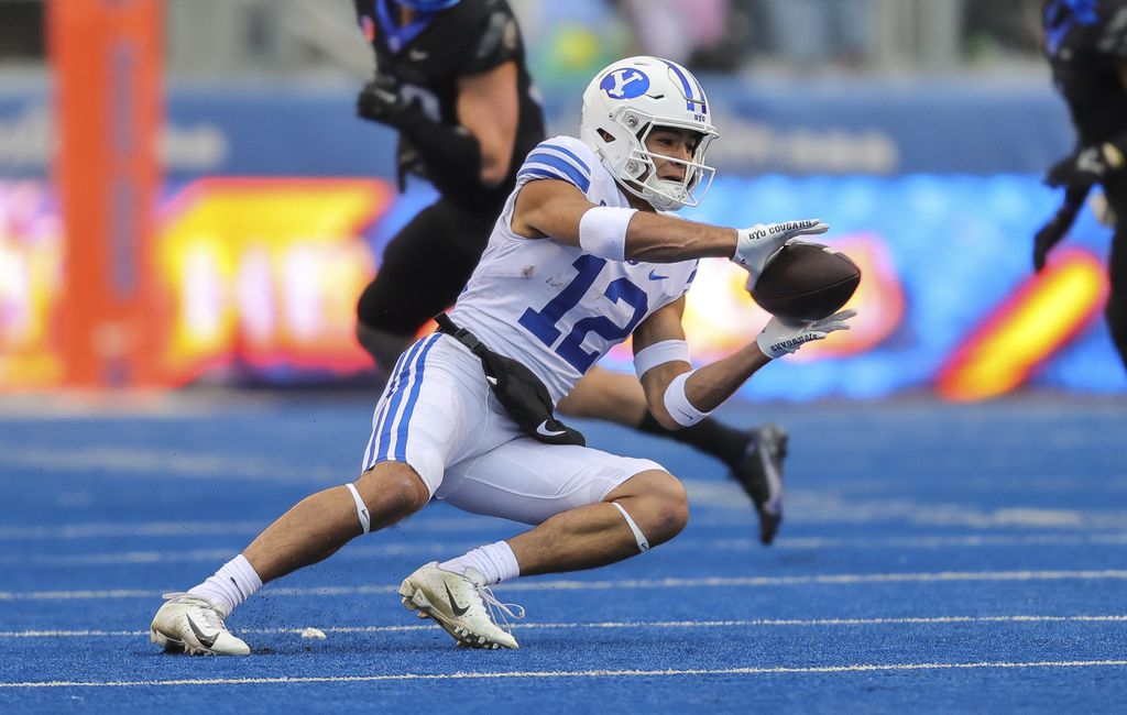 (Steve Conner | AP) BYU wide receiver Puka Nacua (12) catches the ball against Boise State in the first half of an NCAA college football game, Saturday, Nov. 5, 2022, in Boise, Idaho.