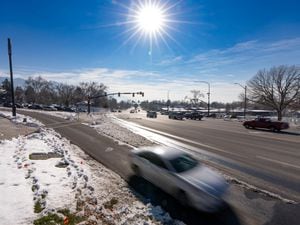 (Francisco Kjolseth | The Salt Lake Tribune) Traffic moves along Foothill Dr. and Sunnyside Ave. in Salt Lake City on Tuesday, Dec. 21, 2021.