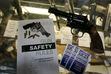 (Brennan Linsley | The Associated Press) Gun safety and suicide prevention brochures are on display next to guns for sale at a retail gun store in Colorado.