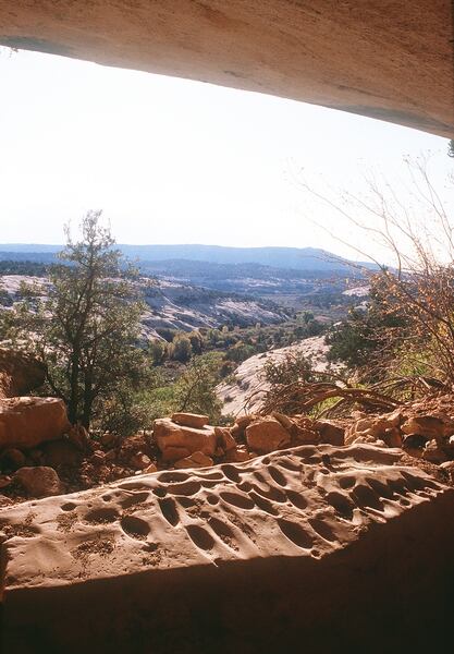 (Al Hartmann | The Salt Lake Tribune) Anasazi grinding rock under sandstone alcove in canyon along Elk Ridge west of Blanding in San Juan County. The area was included in Bears Ears National Monument.