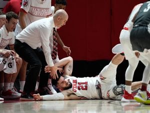 (Francisco Kjolseth | The Salt Lake Tribune) Utah Utes forward Dusan Mahorcic (21) ends up on the floor by his teammates while battling the Washington State Cougars in game action during an NCAA college basketball game at the Jon M.Huntsman Center, on Saturday, Jan. 8, 2022. Utah lost 61-77.