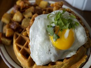 (Leah Hogsten |  Salt Lake Tribune file photo)  Chicken and waffles, with a fried egg on top, is a brunch menu item at the Hub & Spoke Diner in Salt Lake City.