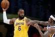 Los Angeles Lakers forward LeBron James (6) is defended by Utah Jazz guard Jordan Clarkson, right, during the first half of an NBA basketball game in Los Angeles, Monday, Jan. 17, 2022. (AP Photo/Ringo H.W. Chiu)