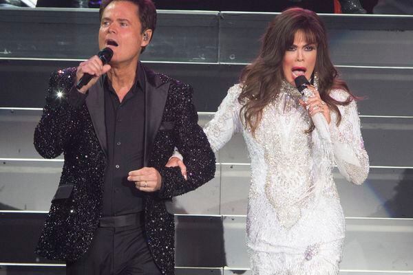 (AP File | Owen Sweeney/Invision) This Aug. 22, 2017 file photo shows Donny Osmond, left, and Marie Osmond performing at the Santander Arena in Reading, Pa. One of the producers of their 1978-79 ABC variety show, Mary Krofft, recently died at the age of 86.