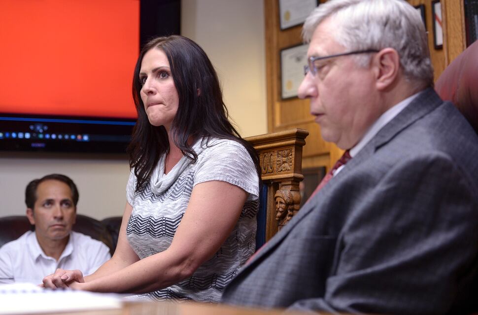 Leah Hogsten | The Salt Lake Tribune Brenda Mayes, center, and her fiance Terry Martinez, left, joined attorney Robert Sykes, right, during a press conference announcing the lawsuit they filed, Tuesday, May 7, 2019 against the Davis School District, accusing a bus driver of racial discrimination against her son.