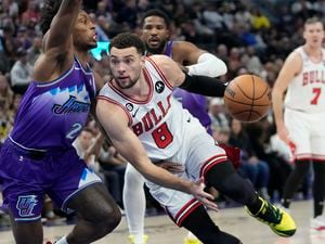 Chicago Bulls guard Zach LaVine (8) drives to the basket as Utah Jazz guard Collin Sexton (2) defends during the second half of an NBA basketball game Monday, Nov. 28, 2022, in Salt Lake City. (AP Photo/Rick Bowmer)