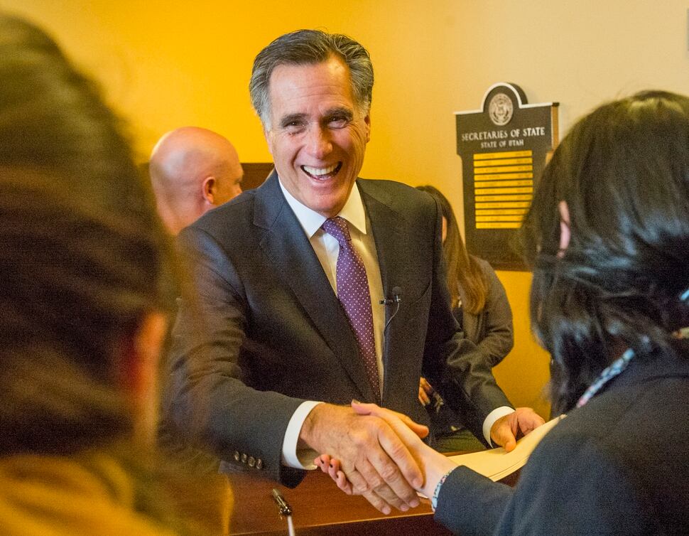 (Rick Egan | The Salt Lake Tribune) Mitt Romney jokes with Election Specialists, Lauren Shafer and Lauren Wilko, as he files to run for the United States Senate, in the Lt. Governor's office at the State Capitol, Thursday, March 15, 2018. 