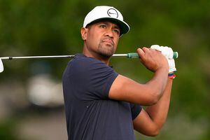Tony Finau watches his tee shot on the 11th hole during the first round of the PGA Championship golf tournament, Thursday, May 19, 2022, in Tulsa, Okla. (AP Photo/Matt York)