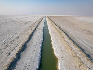 (Francisco Kjolseth | The Salt Lake Tribune) The myth of the Bonneville potash canals. Photos and videos of people  paddleboarding and swimming in them have drawn hundreds of thousands of views on Instagram, but are they as exotic as they look, or are they toxic? The water is an unnatural green-blue shade and though they stand in stark and beautiful contrast to the unending flat, white salt desert, they are definitely not an oasis. 