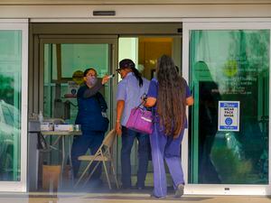 (Leah Hogsten  |  The Salt Lake Tribune) Visitors entering Montezuma Creek Community Health Center are screened for possible COVID-19 symptoms with a temperature check, June 24, 2020.  The Montezuma Creek clinic is one of five other Utah Navajo Health System clinics in San Juan County.
