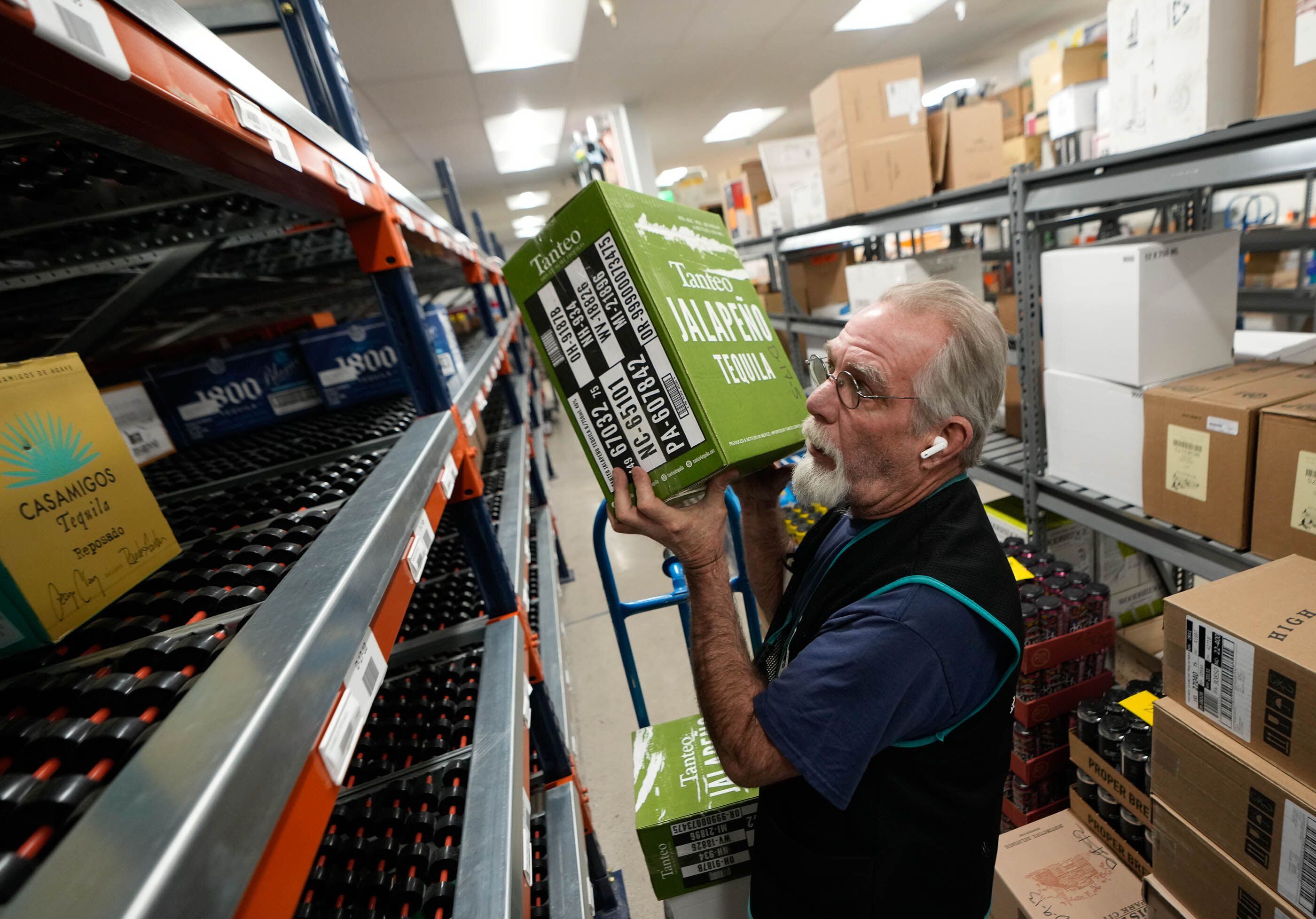 (Francisco Kjolseth  |  The Salt Lake Tribune) Rod Blowers, a warehouse worker at the Park City Club liquor store stocks shelves on Thursday, April 24, 2024. The liquor commission toured the repaired and updated space following a roof collapse last year from heavy snow. 