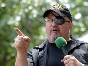 (AP Photo/Susan Walsh, File) Stewart Rhodes, founder of the citizen militia group known as the Oath Keepers speaks during a rally outside the White House in Washington, on June 25, 2017. Rhodes formally launched the Oath Keepers in Lexington, Massachusetts, on April 19, 2009, where the first shot in the American Revolution was fired.