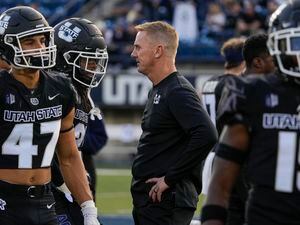 (Leah Hogsten | The Salt Lake Tribune) Utah State Aggies head coach Blake Anderson talks with his players as the Utah State Aggies host Brigham Young University Cougars on Oct. 1. On Friday, it was announced that Anderson had verbally agreed to a two-year contract extension with USU.